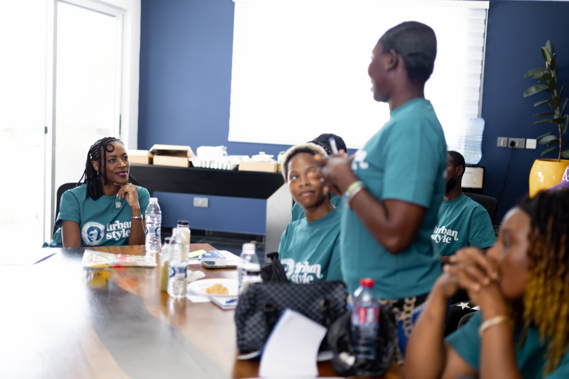 Providers discussing together around the table at the Urban Style training